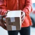cropped-shot-of-a-delivery-man-handing-over-a-pack-2023-11-27-05-35-46-utc.jpg